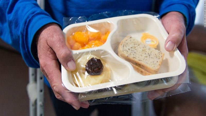 An image of a food try bearing a nutritious meal, delivered or for take-out.