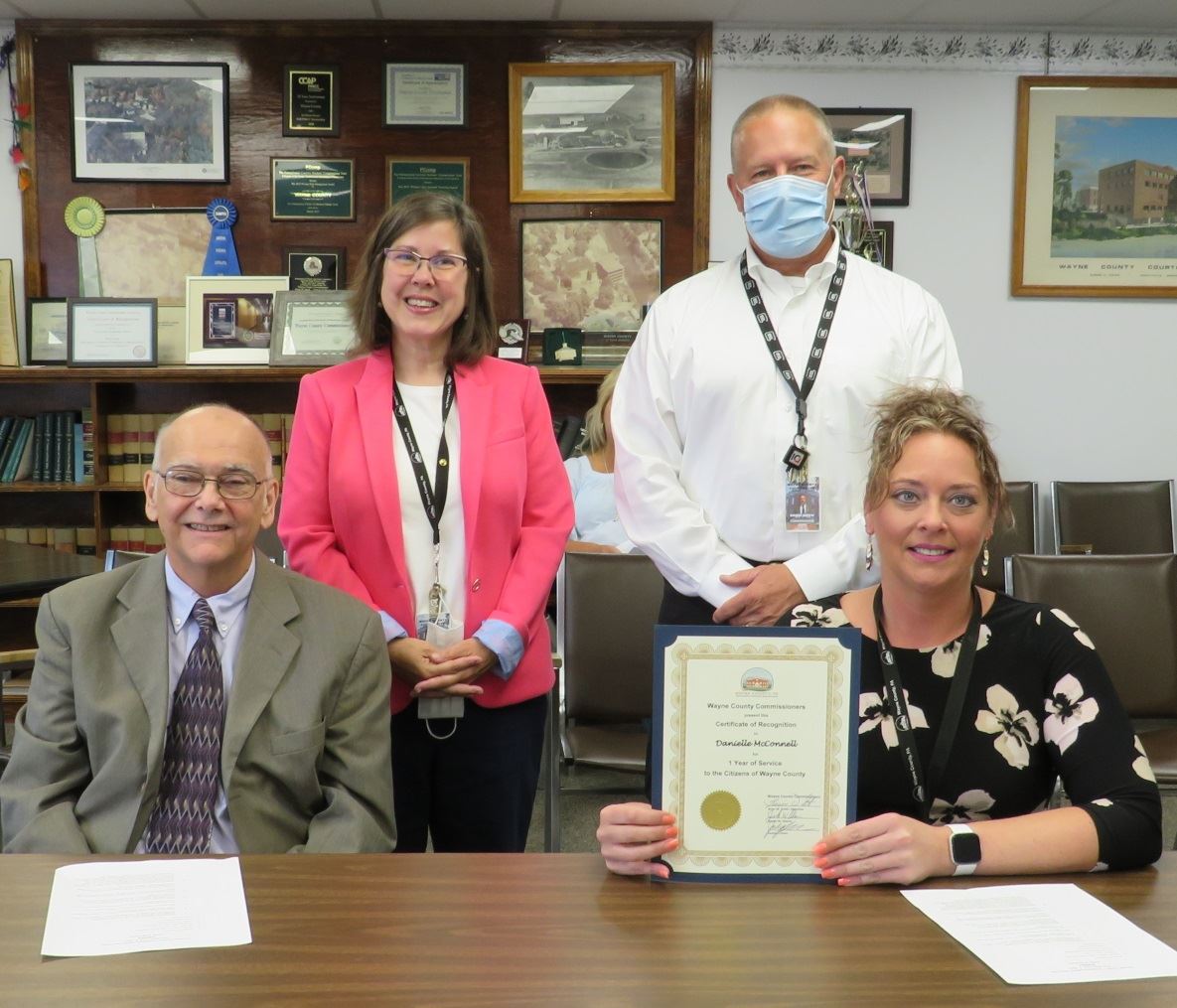 Danielle McConnell  with the Commissioners marking one year of service to the people of Wayne County