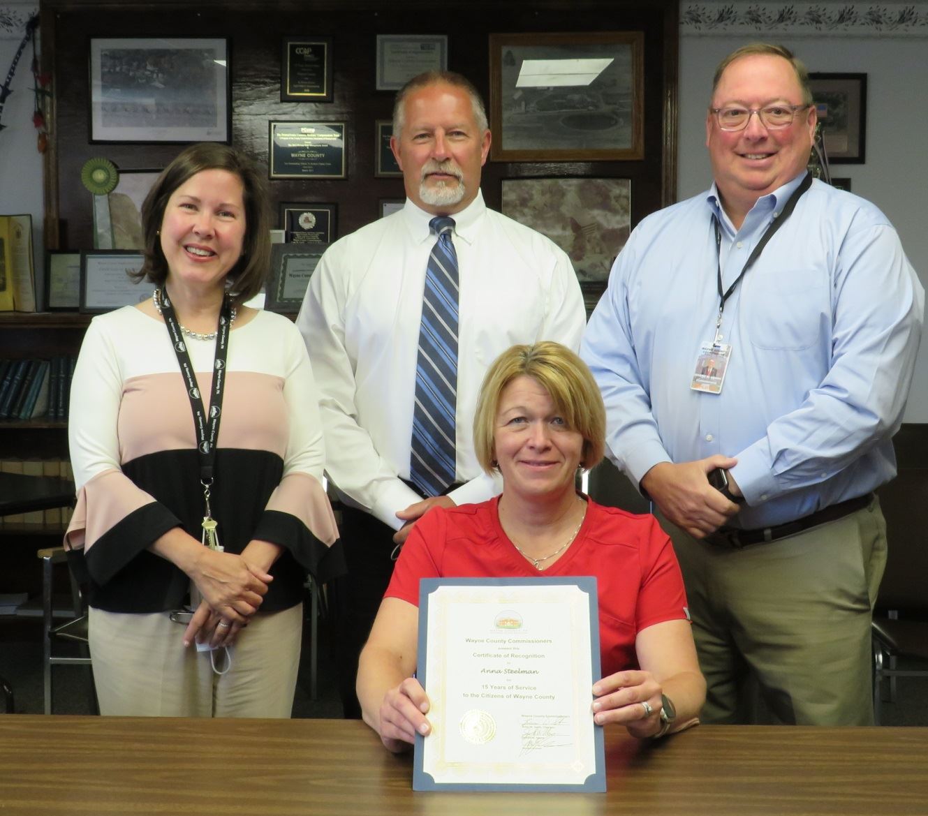 Anna Steelman  with the Commissioners marking 15 years of service to the people of Wayne County.