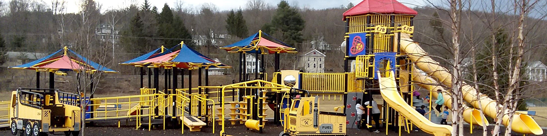 Children enjoying the all abilities play structures at the CJR Memorial Playground in Hawley.